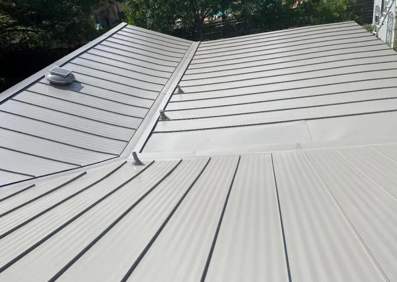 Solar attic fan installed on a metal roof for Roof Ventilation in Madera Ranchos